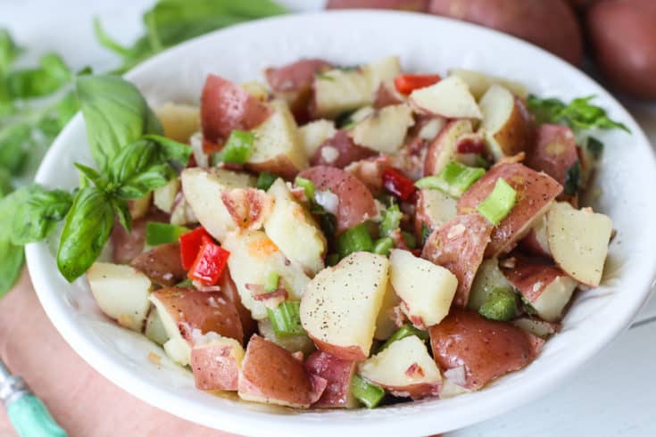 This flavorful Italian Potato salad is always a staple at any summer gathering I host. It's perfect for summer parties, potlucks or just as a simple side dish.....and it has bacon in it! Enough said!