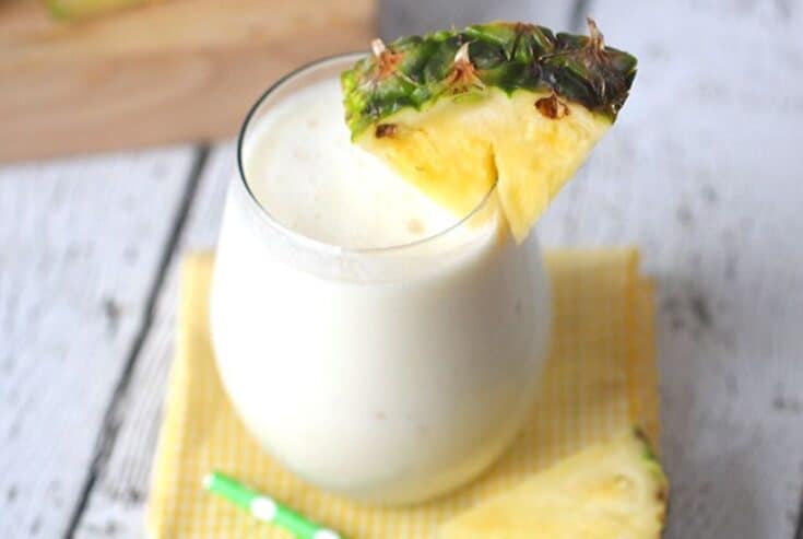 This Dole Whip Smoothie recipe is inspired by my favorite Walt Disney World Treat. This easy smoothie recipe is full of pineapple flavor and is perfect for breakfast, lunch or a snack. This Dole Whip recipe is the next best thing to visiting Disney World. #dolewhiprecipe #disneyfood #disneysnack #disneyrecipe #breakfastsmoothie #dolewhip