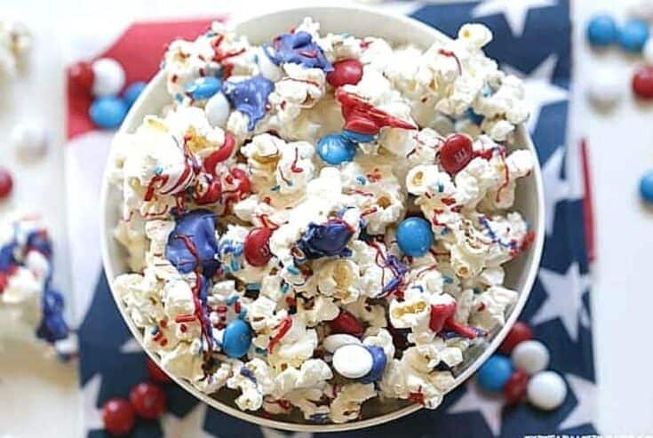 Salute the red, white and blue with this tasty Patriotic White Chocolate Popcorn. This easy popcorn recipe is perfect for a 4th of July Party or patriotic celebration.