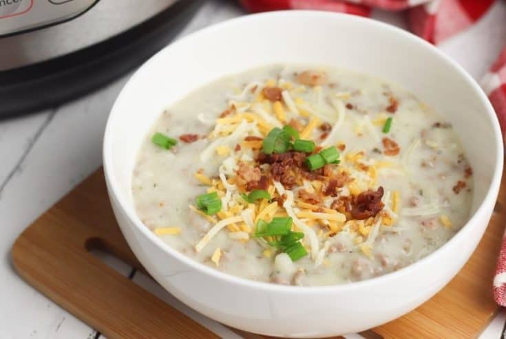 Warm up with a comforting bowl of this tasty Instant Pot Cheeseburger Soup. This hearty Instant Pot soup recipe is made from scratch and ready in no time. #instantpotrecipe #soup #cheeseburgersoup