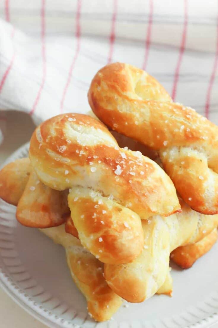 Craving a salty snack? Whip up a batch of these Easy Homemade Soft Pretzel Twists. This easy snack recipe won't last long. This basic pretzel dough recipe can be shaped into twists, knots, bites or the classic pretzel shape.