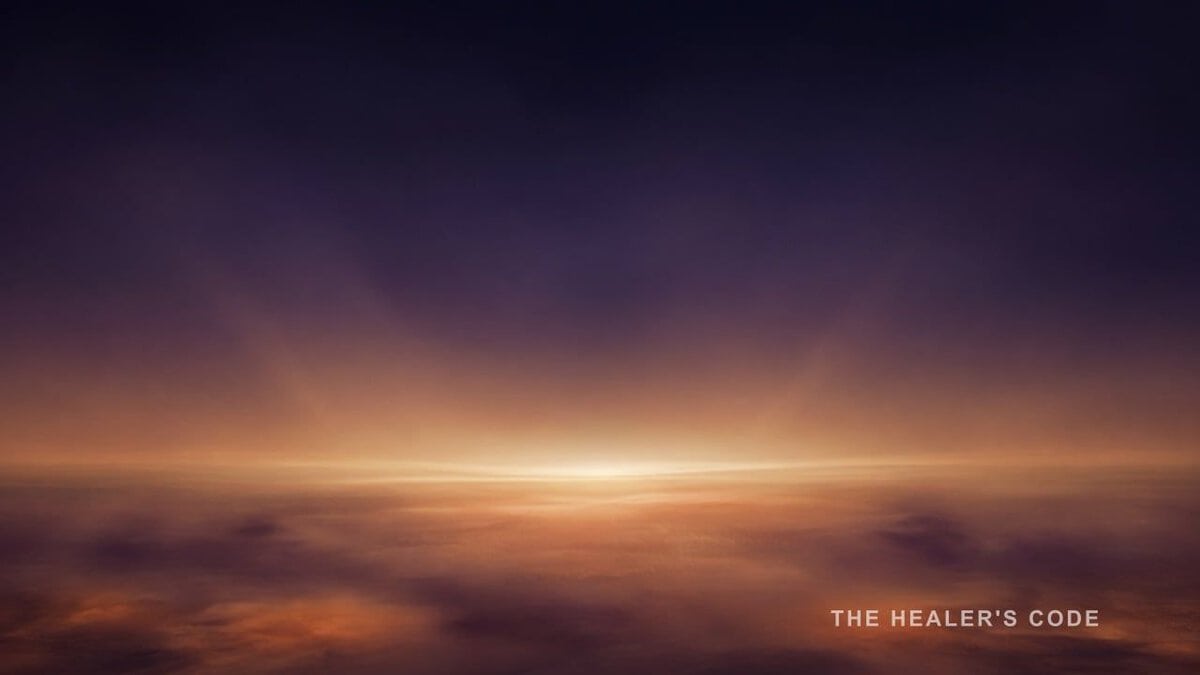 Gold light unfolds along a distant horizon in a deep indigo twilight sky