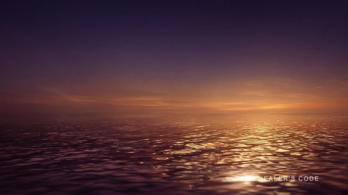 Gold light dissolving across a dark water surface in indigo dusk