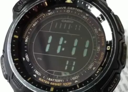 Digital wristwatch displaying 11:11:11, digital display