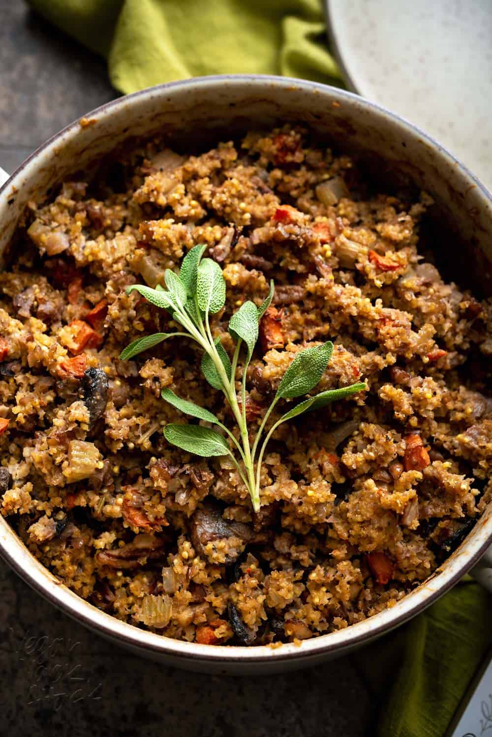 Stuffing is one of my favorite sides, at holiday dinners. So that no one feels left out, I've made this tasty, Gluten-free Millet Stuffing for everyone! Plus, it's in the cutest baking dish. #vegan #Danskdesign #dansk #thanksgiving #glutenfree