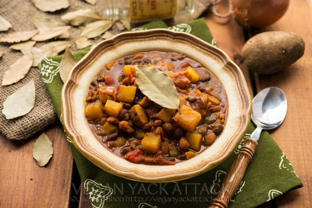 Image of a bowl of slow cooker potato curry chili with green linen and spoon