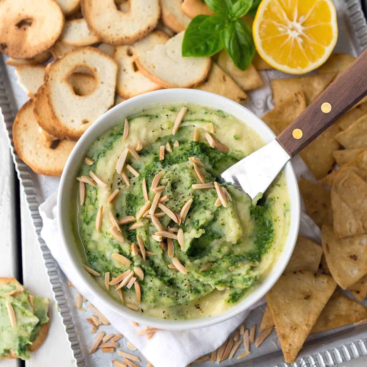 This Creamy Cauliflower Pesto Dip is oil-free, dairy-free, vegan and delicious! It makes for a great, healthy appetizer for parties, or just to snack on.