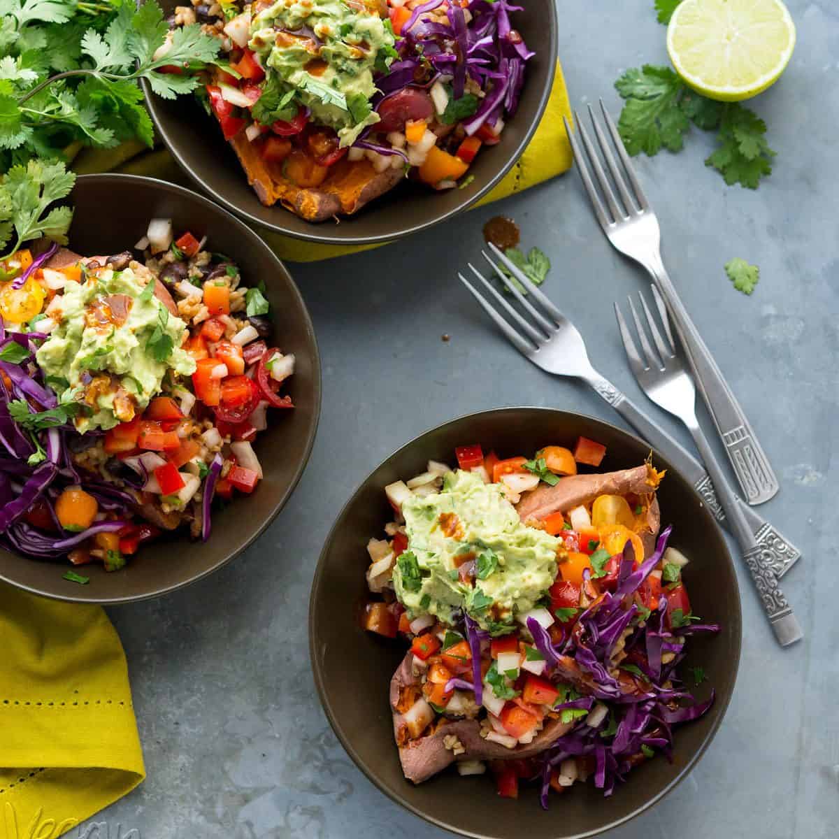 Burrito-Stuffed Sweet Potatoes - Black beans with rice, Rustic salsa and a simple guacamole stuffed inside roasted sweet potatoes! From The First Mess Cookbook #glutenfree #soyfree #giveaway