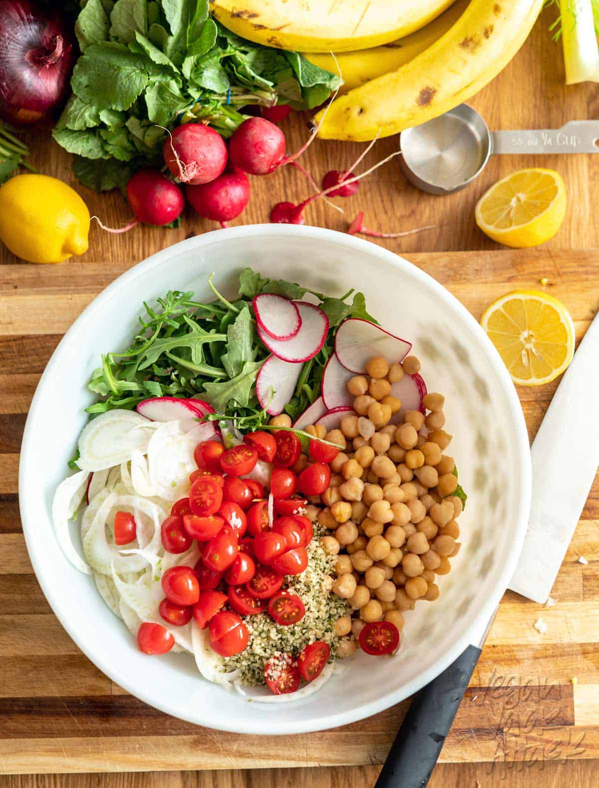 Image of ingredients for the quinoa chickpea fennel salad in a bowl before combining
