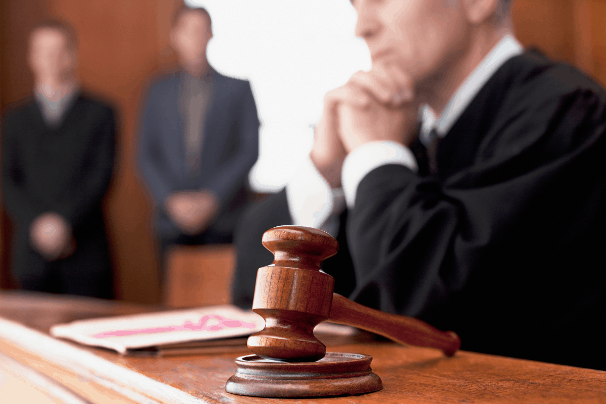 Judge listens in courtroom to the presentation of a personal injury case against a company
