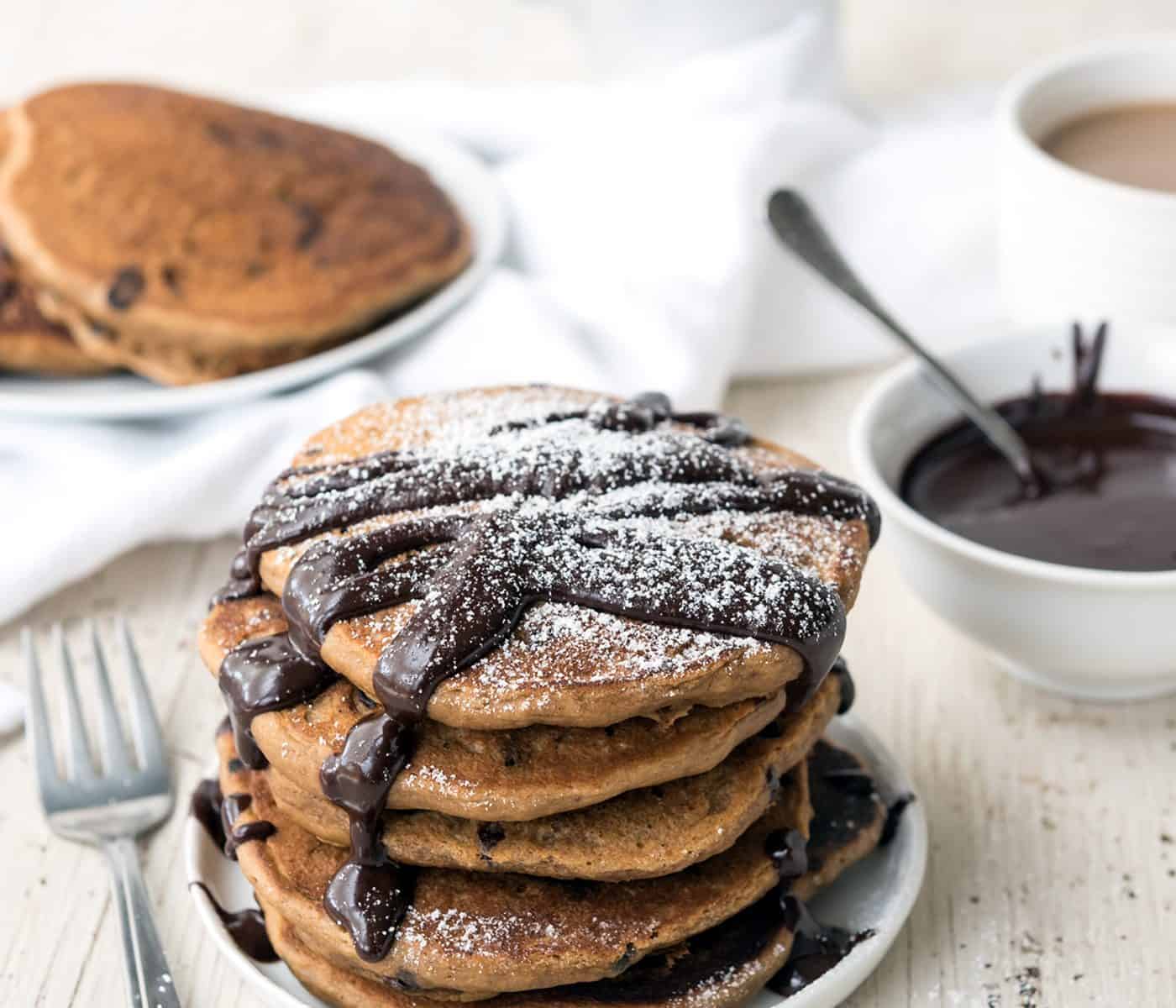Fluffy Mocha Pancakes with Easy Chocolate Sauce! Perfect for a decadent brunch, plus it has some added protein. #vegan #soyfree
