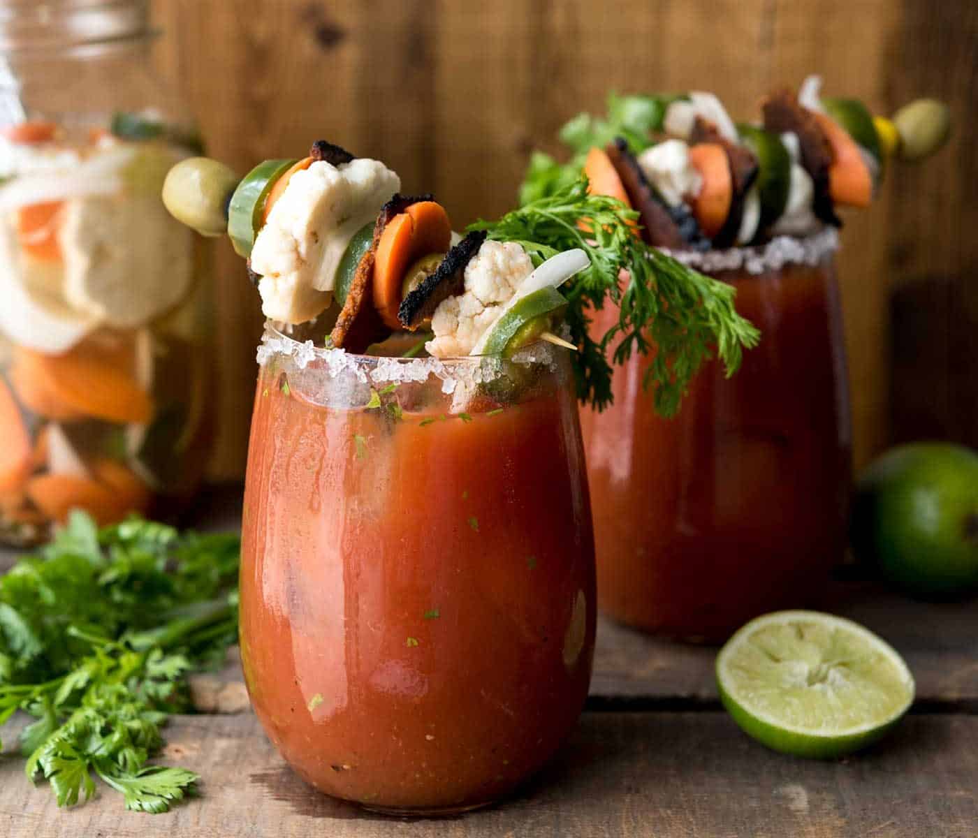 Loaded Chipotle Bloody Mary! Full of flavor from fresh cilantro, lime, homemade escabeche and #vegan bacon. #fathersday #craftyourcocktail