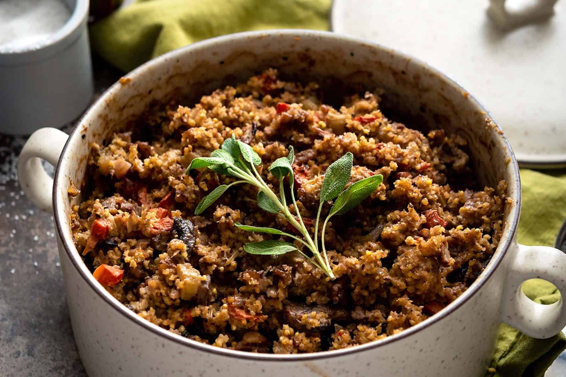 Stuffing is one of my favorite sides, at holiday dinners. So that no one feels left out, I've made this tasty, Gluten-free Millet Stuffing for everyone! Plus, it's in the cutest baking dish. #vegan #Danskdesign #dansk #thanksgiving #glutenfree