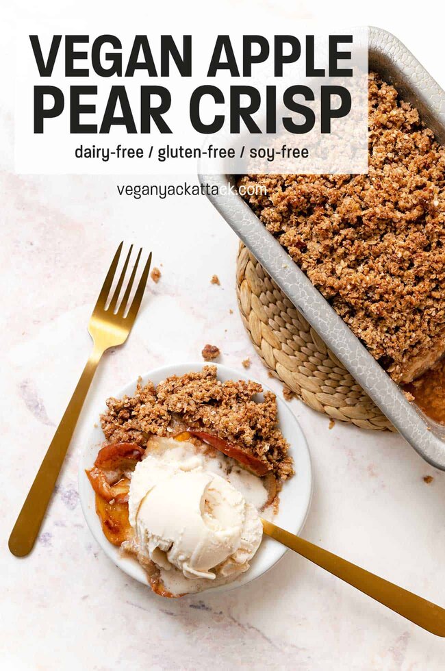 Vegan Apple Pear Crisp A small plate with a scoop of ice cream and scoop of apple pear crisp with gold forks