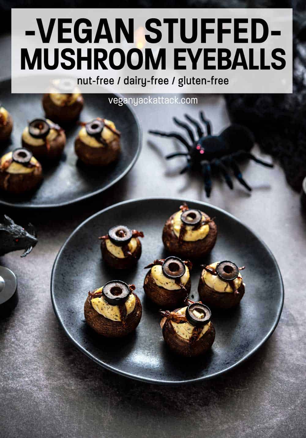 Mmm.. Delicious eyeballs! No, no cannibalism here, just some Stuffed Mushroom Eyeballs, filled with a garlicky tofu ricotta! Stuffed mushrooms on black plates with text reading "Vegan Stuffed Mushroom Eyeballs"