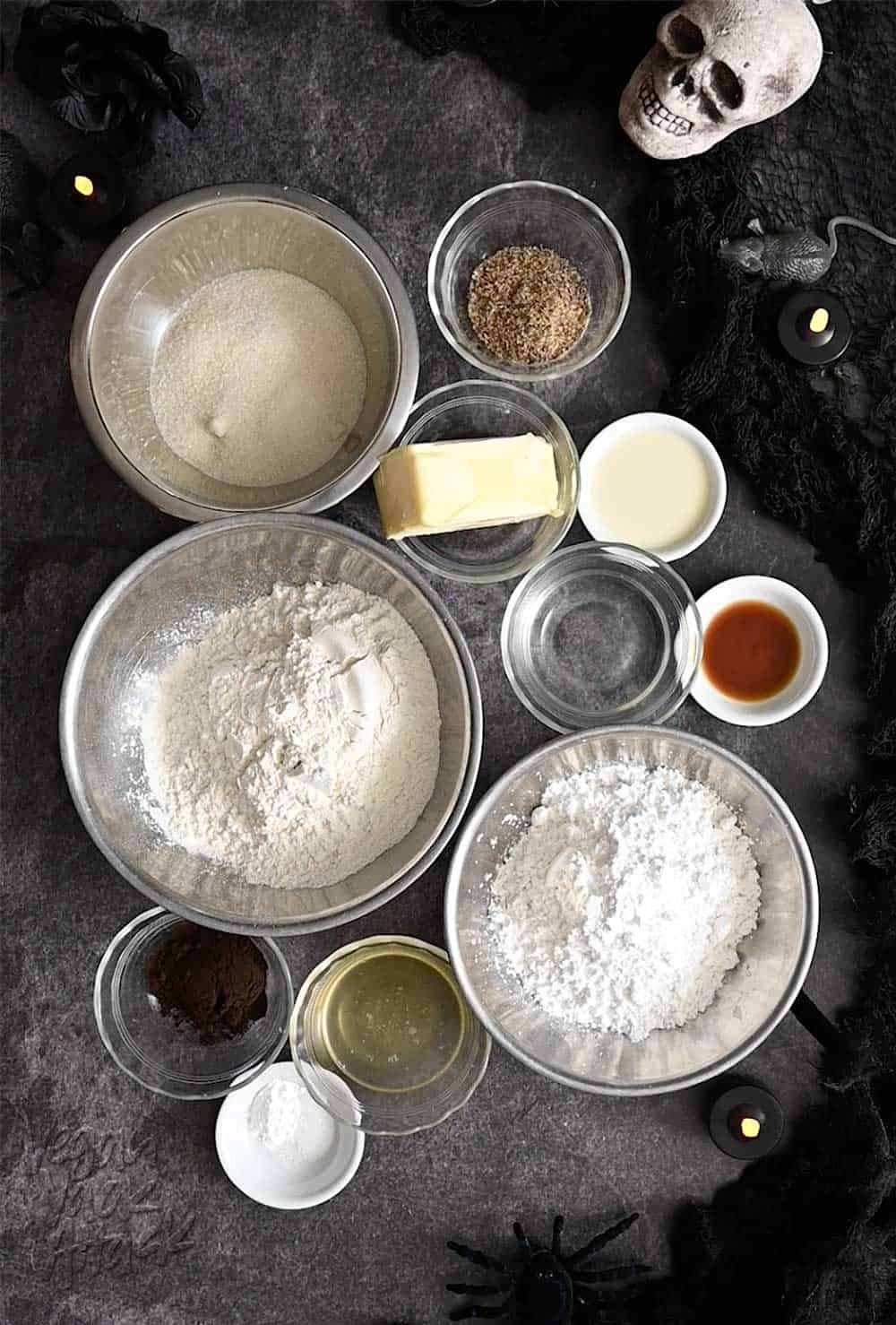 All ingredients for shortbread cookies in small bowls and ramekins