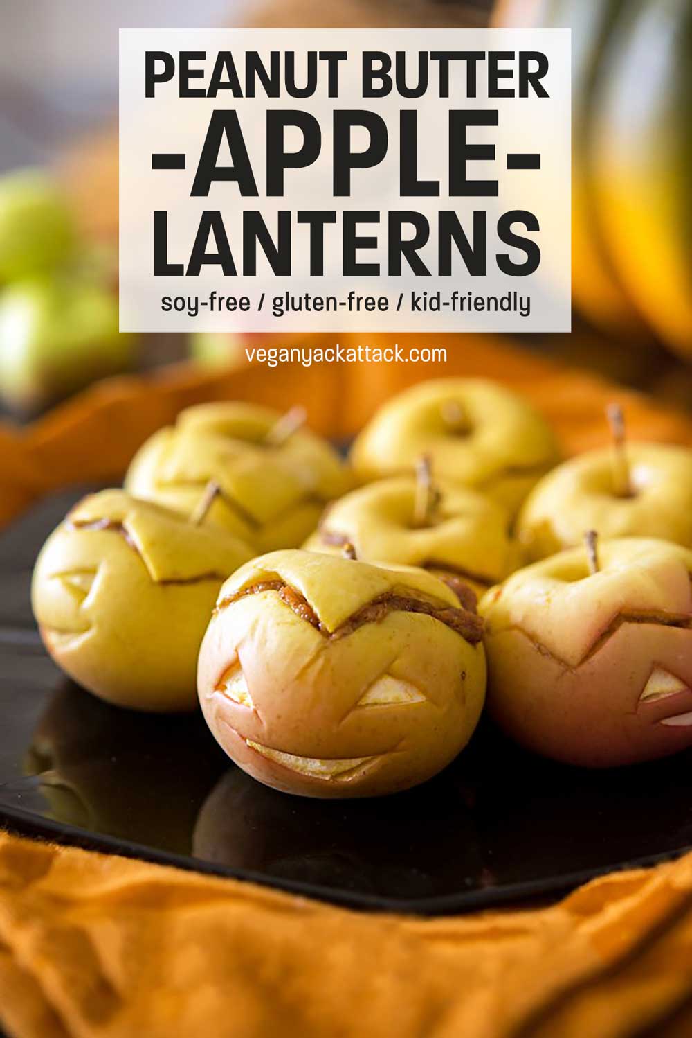 Cute and tasty Peanut Butter Apple-Lanterns appetizers that come together quickly and are perfect for Halloween and Kid snacks! Close up of peanut butter-stuffed apples with faces and text reading "Peanut Butter Apple-Lanterns"