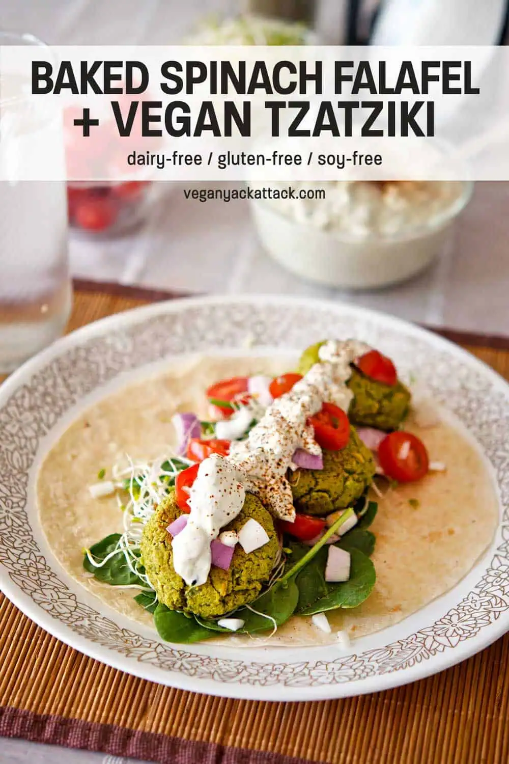 Spinach Falafel Wrap with Tzatziki Sauce vegan Plate of baked falafel in a tortilla with vegan tzatziki and fresh ingredients