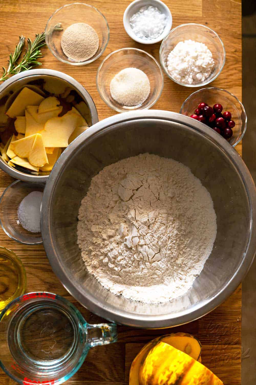 Ingredients for squash focaccia in small bowls on a table