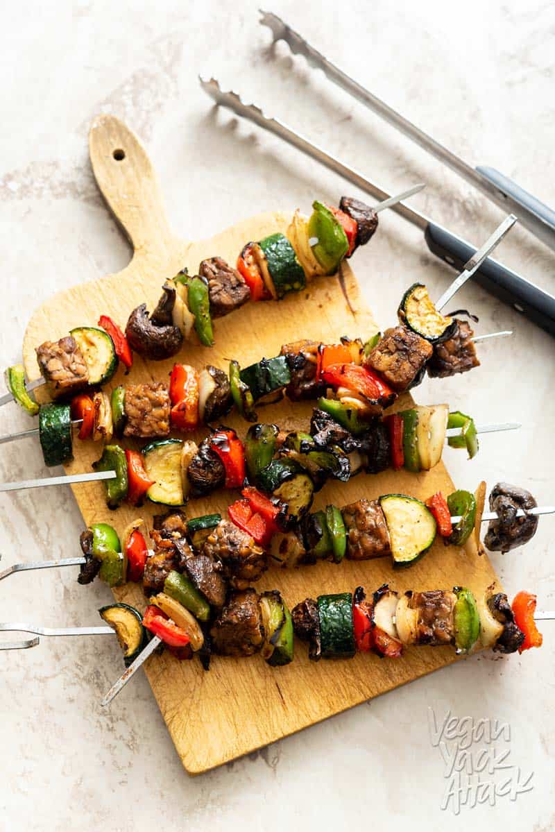 Marinated Tempeh Veggie Skewers on a bread board