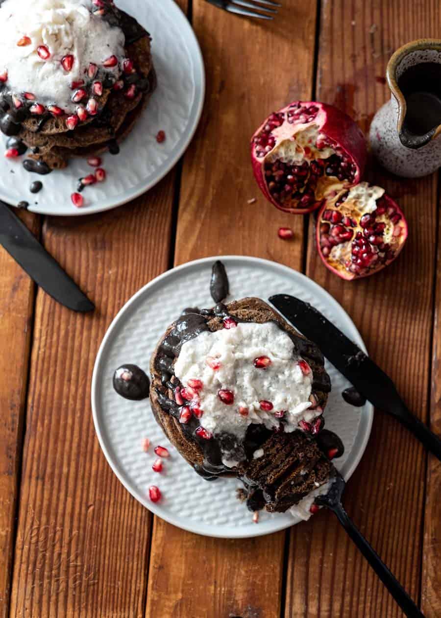 These Spooky Buckwheat Pancakes are eye-catching and delicious! Fluffy pancakes drizzled with a sweet black sesame sauce and topped with pomegranates, what more could you want? #Vegan #nutfree #glutenfreeoption #soyfree #halloween #veganrecipes