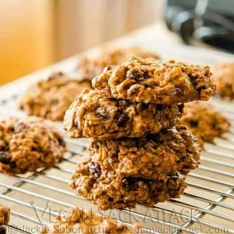 Persimmon Oatmeal Cookies stacked on one another on a cooling rack