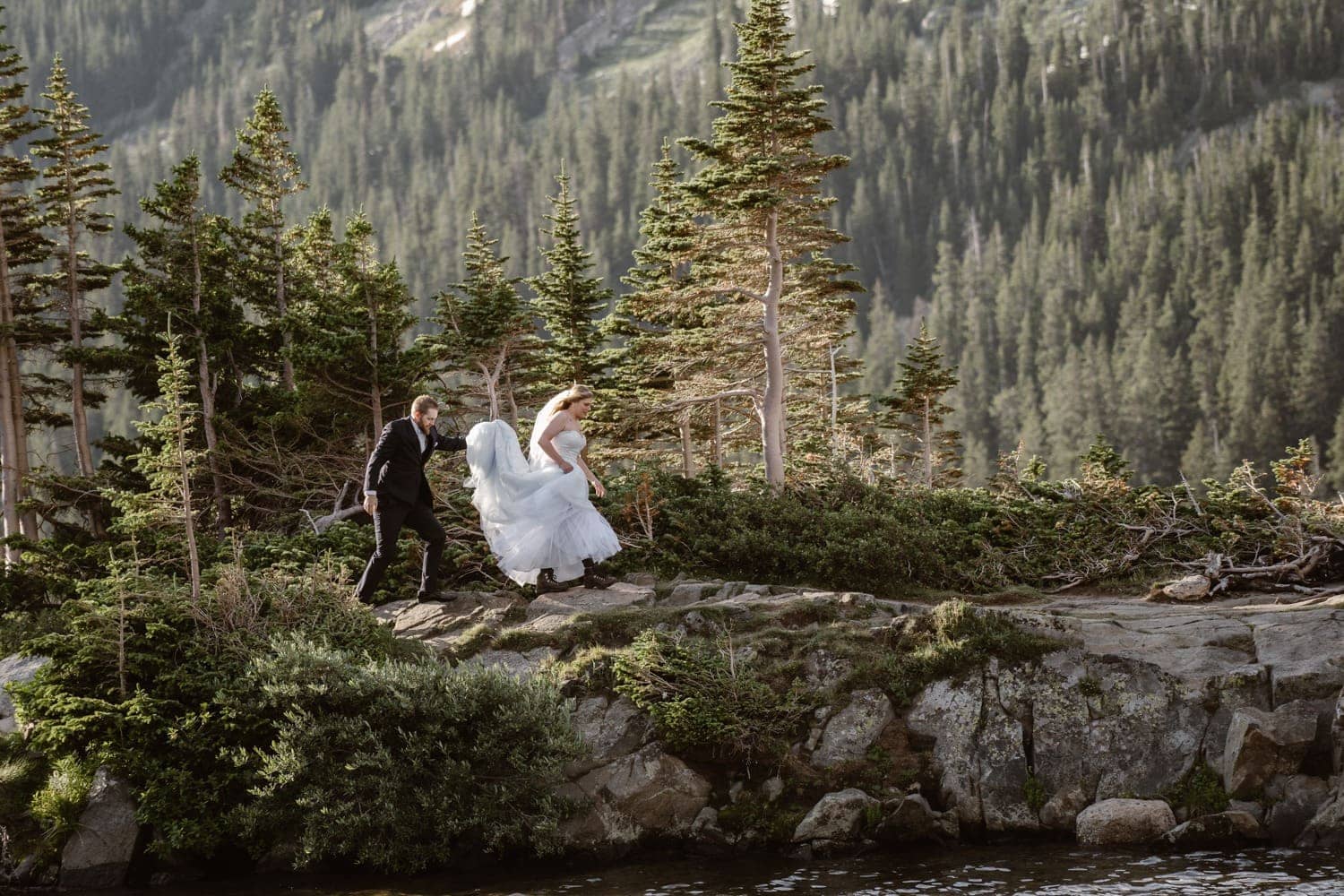 Bride and Groom Hiking at Colorado Adventure Elopement