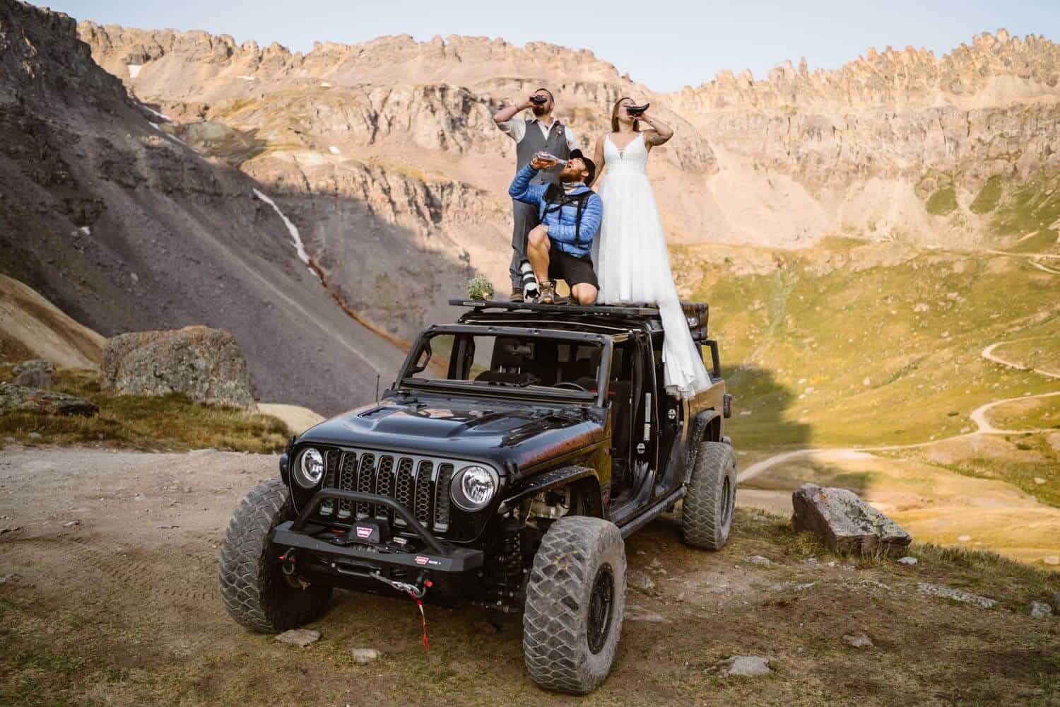 Bride and Groom Drinking Champagne Colorado Off-Roading Elopement