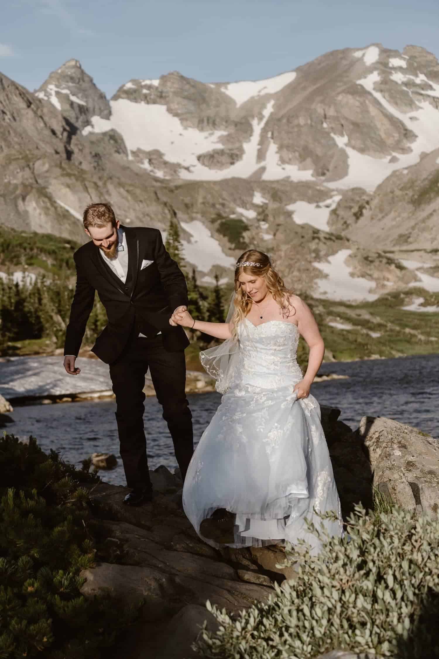Bride and Groom Hiking at Colorado Adventure Elopement