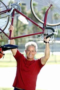 the man lifting the bike
