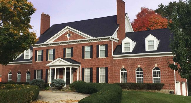 Thibert_After-Gaf timberline asphalt roofing edited Grand house with black asphalt Timberline shingles in autumn