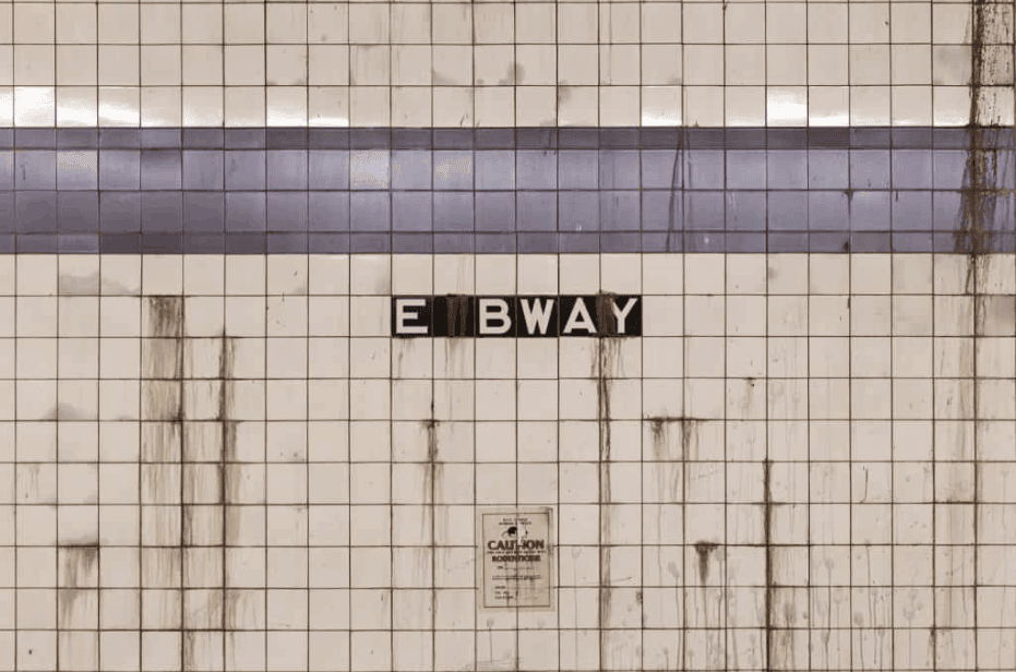 LES Subway Station NYC Image of a grimey subway station wall with rat bait warning. Heading to the LES needle Exchange harm Reduction location on Alan Street.