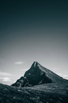 Black and white photo of a mountain in Norway, capturing the tranquility of nature.