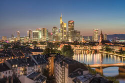 Photo art by Michael Valjak: Evening view over Frankfurt with illuminated skyscrapers