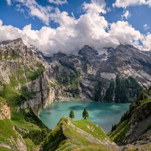 Photo art by Achim Thomae: tranquil mountain lake surrounded by alpine scenery