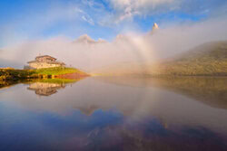 Acrylic Glass Print by Achim Thomae: fog bow over the Dolomites in soft golden hour light