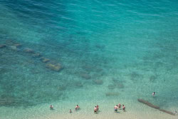Photo art by Diana & Ronnie: sunny beach with people by turquoise water Photo art by Diana & Ronnie: sunny beach with people by turquoise water