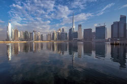 Wall art by Achim Thomae: Cityscape of Dubai featuring water and skyscrapers