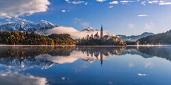 Photo art by Achim Thomae: sunrise over Lake Bled in soft colors.