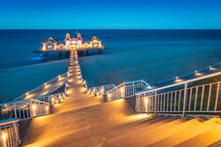 Photo art by Martin Wasilewski: twilight over the pier in Sellin, soft colors