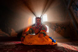 Photo art by Dennis Schmelz: detailed Bhutanese mask with spiritual aura