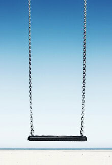 Photo art by Manuela Deigert: swing on the beach with a view of the sky