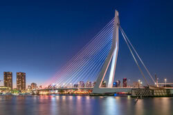 Photo art by Achim Thomae: illuminated Erasmus Bridge in Rotterdam at blue hour.