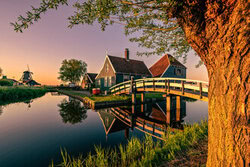 Photo art by Achim Thomae: sunrise over a windmill in Holland