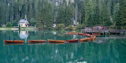 Acrylic Glass Print by Achim Thomae: tranquil landscape at Braies Lake with wooden boats
