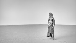 Portrait of an Amazir wearing a traditional turban in the Moroccan desert