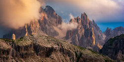 Fotokunst von Martin Wasilewski: Cadini-Gruppe bei Sonnenuntergang über den Dolomiten.