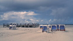 Wall art by Achim Thomae: Beach life at the North Sea with beach chair and clouds