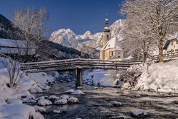 Photo art: Winter landscape with snow-covered mountains and a church in Upper Bavaria