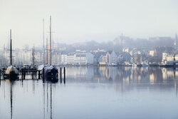 Photo art by Nadja Jacke: calm winter morning at Flensburg Harbour with fog.
